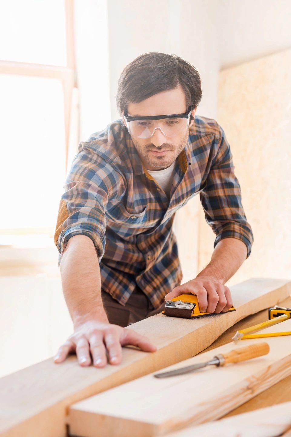 Electrician installing a ceiling fan